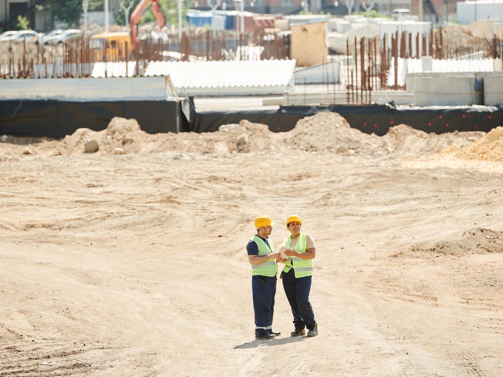 Construction management — site team reviewing the work