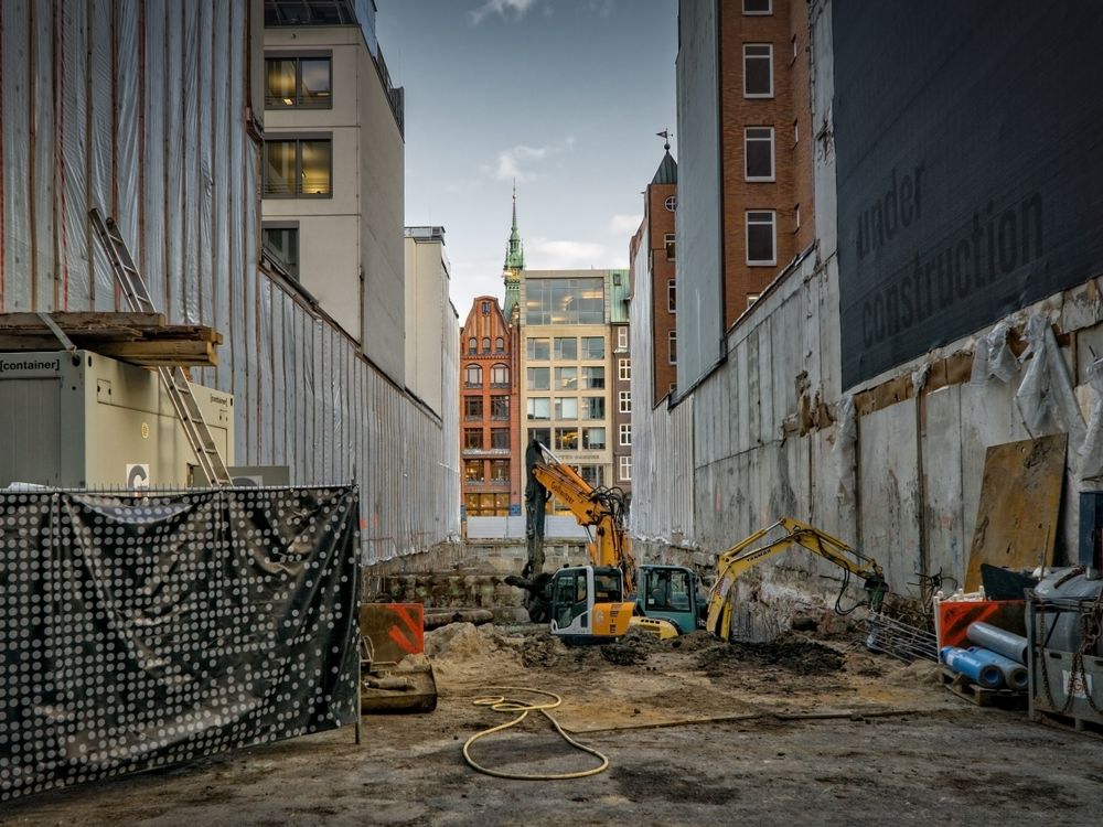 Demolition — excavators clearing a construction site